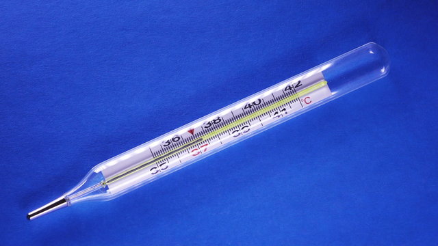 mercury thermometer. The mercury column, temperature rises to 42 degrees