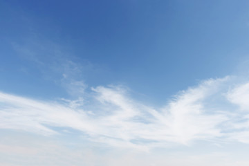 Naklejka na ściany i meble Fantastic soft white clouds against blue sky background, soft fo