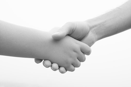 Pact between a youth and an adult with a handshake