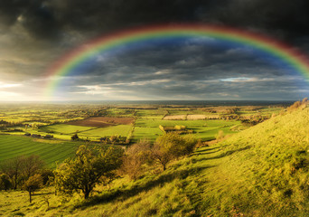 Obraz premium Stunning Summer sunset across countryside landscape with dramati