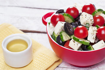 Greek salad in red boul