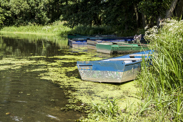Fototapeta na wymiar Old boat on the lake