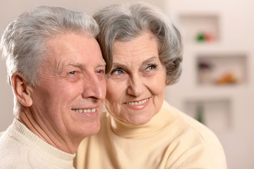 Elderly people sitting on couch