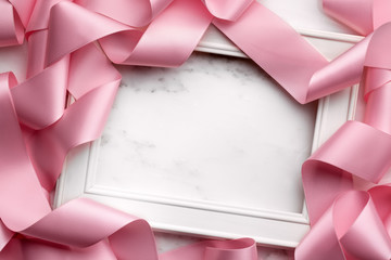 Picture frame wrapped in gift ribbon