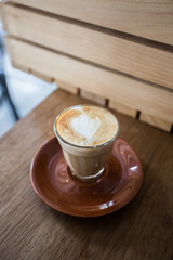 glass of hot piccolo latte coffee
