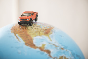 Offroad car on globe © Deyan Georgiev