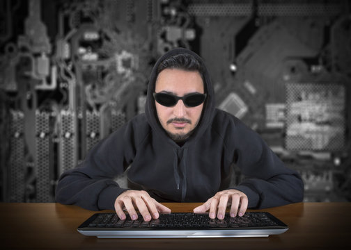 Computer Hacker With Digital Background