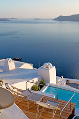 white and blue  house in santorini pool