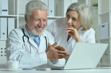 senior Doctors   with laptop