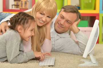 happy family playing  on computer