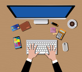 workspace with computer monitor keyboard mouse coffee wallet calculator hand and smartphone