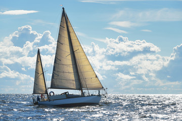 Old expensive vintage two-masted sailboat (yawl) close-up, sailing in an open sea. Coast of Maine,...