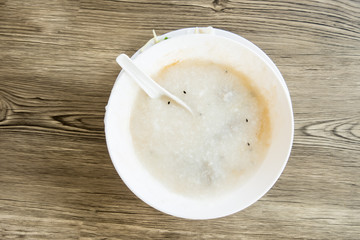 Congee with black sesame in white bowl, breakfast time