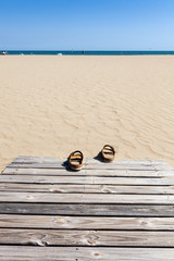 Obraz premium Summer sandals on beach