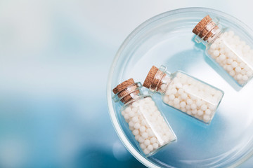 homeopathic pills lying on petri dish in a laboratory