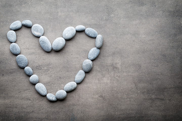 Heart from the spa stones, on the grey  background.