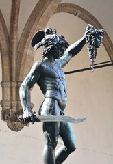 Perseo and Medusa, the famous statue in bronze of Cellini in Florence; the mythology in Italy. - 102660284