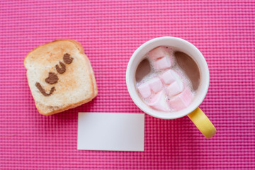 Love message on Bread sliced with and chocolate cup on pink yoga