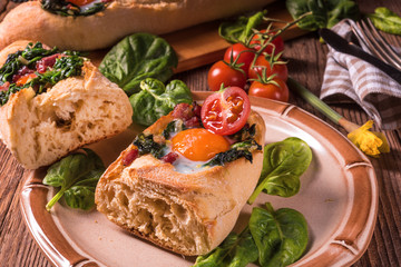 farmer baguette filled with egg, bacon and spinach