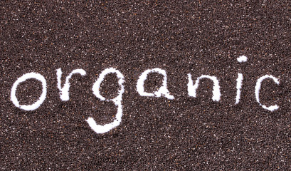 chia seeds. organic word made from chia seeds background