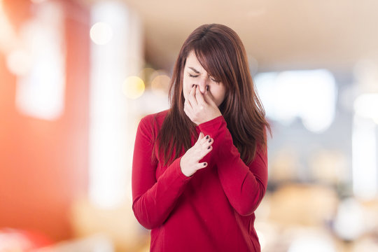 Young Girl Holding Her Nose