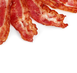 Cooked bacon rashers close-up isolated on a white background.