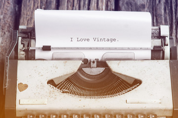 vintage typewriter on the wood desk with message i love vintage