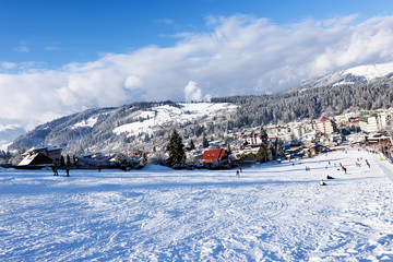 Ski slope at Vatra Dornei mountains with blue sky, Romania