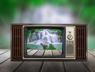 Old vintage TV in the Vintage wooden with water fall view