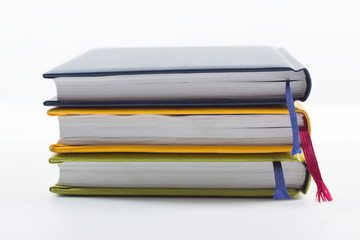 Stack of hadrback books on white background. Library education concept. Back to school. Copy space