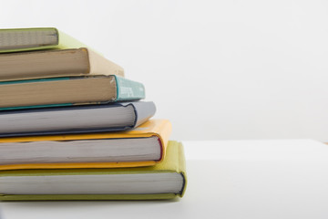 Stack of hadrback books on white background. Library education concept. Back to school. Copy space