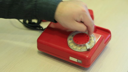 Rotating red phone disk
- Powered by Adobe