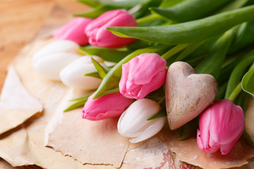 Tulip flowers and wooden heart