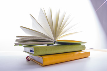 Stack of hadrback books on white background. Library education concept. Back to school. Copy space