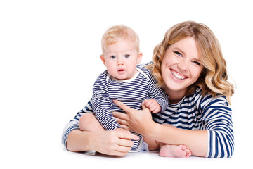 Portrait of happy mother with baby on a white background.