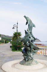 fountain in form of dolphins on embankment of Ayvazovsky park, Partenit, Crimea, Russia