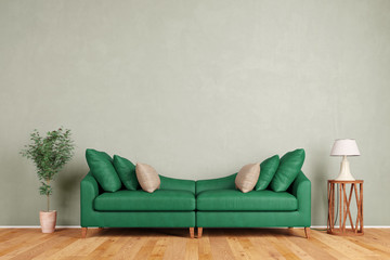 Grünes Sofa vor Wand im Wohnzimmer