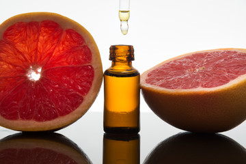 Grapefruit essential oil, extract, essence, in amber bottle with dropper - 102674847