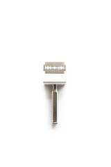 vintage chrome plated razor with a blade on a white background seen from above