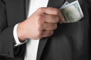 businessman counts money