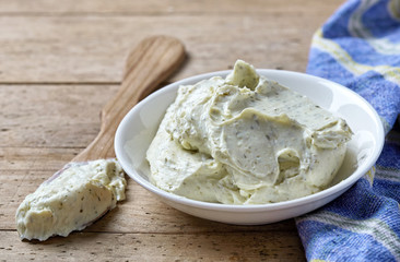 Bowl of cream cheese with herbs