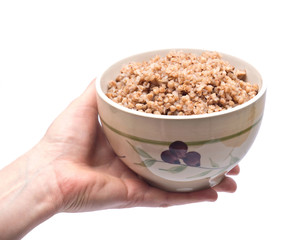 Buckwheat in bowl separated on white background