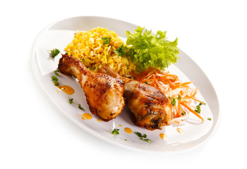 Roasted chicken drumsticks white rice and vegetables