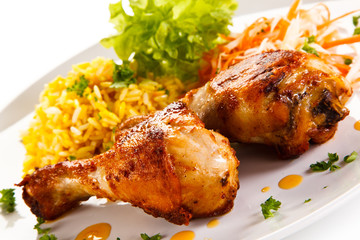 Roasted chicken drumsticks white rice and vegetables