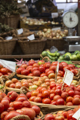 Fresh tomatoes in a market stall.