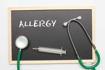 ALLERGY concept with stethoscope and syringe