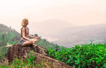 Naklejka na ściany i meble Young woman on tea plantation and beautiful view. Sri-Lanka
