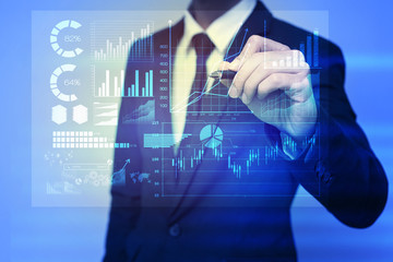 Businessman in blue suit working with digital virtual screen