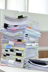 Tower of documents at workplace