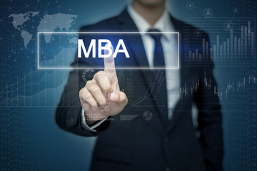 Businessman hand touching MBA button on virtual screen